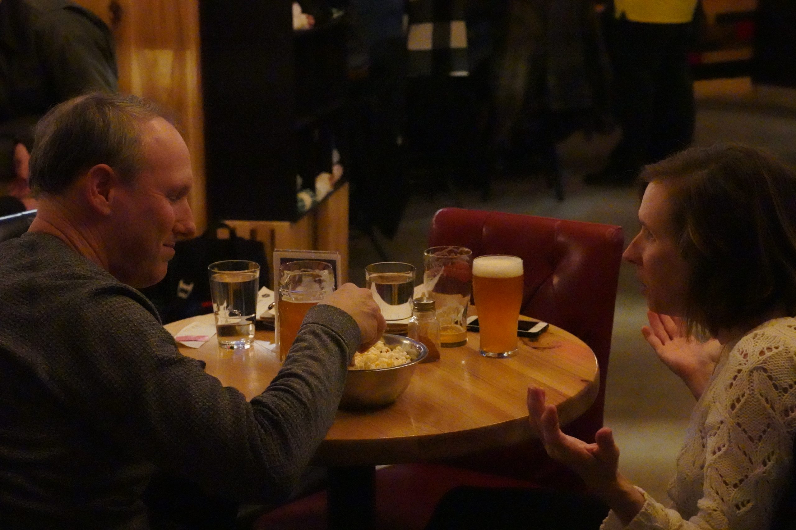 Patty and Andrew Fulton enjoy some popcorn and animated conversation.